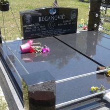 Black laser monument with block pillars Muslim Section, East Elfers Cemetery