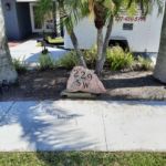 Street numbers carved engraved into rock at residence Clearwater, Fl