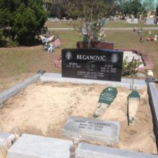 Black laser monument with grey coping lot Muslim Section, East Elfers Cemetery